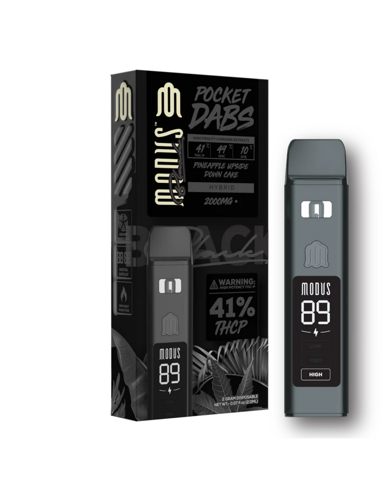 Explore the Modus Black Pocket Dabs Disposable vape, offering the Pineapple Upside Down Cake flavor. This 2g pen contains 41% THCP in a hybrid form and features Ceramic Slow Heat Technology for a smooth vaping experience.