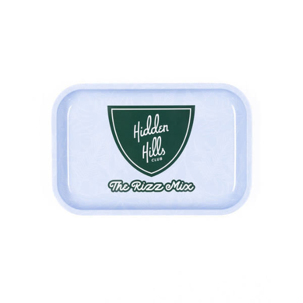 The Mystery Swag from Everyday Delta is a rectangular light blue tray with rounded corners featuring a green "Hidden Hills Club" emblem and white text reading "The Rizz Mix," perfect for adding an element of surprise to your brand merchandise collection.