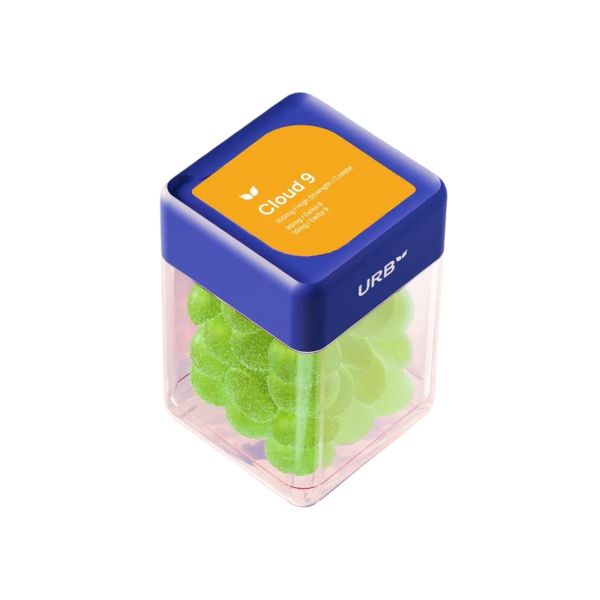 A clear plastic container with a blue lid and an orange label contains green Delta-8 gummies. The label reads "Urb Cloud 9 Skybites Gummies" and says "URB" on the lid.