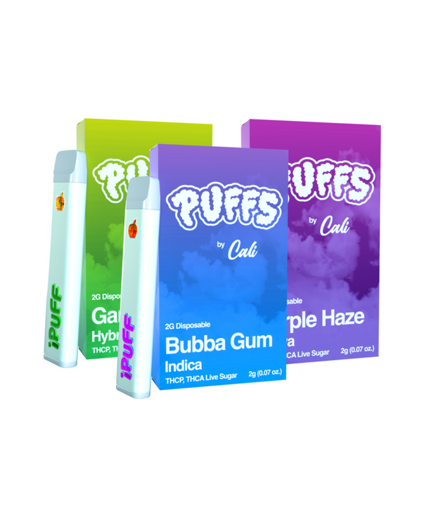 Three vibrant boxes of "Cali Extrax Puffs Disposable" display enticing flavors: Gator Breath, Bubba Gum, and Purple Haze. Each 2g package highlights THC-P Distillate and THC content details.