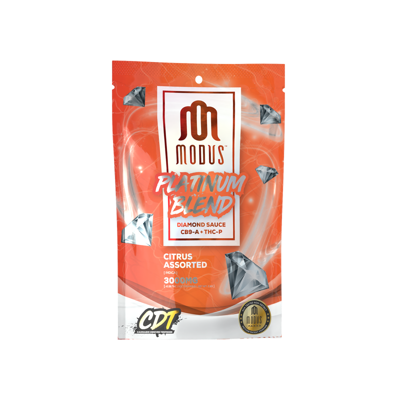 A packaging of Modus Platinum Blend Gummies | 3000mg, labeled "Citrus Assorted" and "300mg". The bag is orange and red with diamond illustrations.